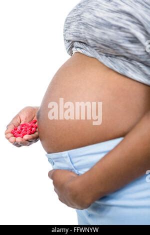 Pregnant Woman Holding Pills In Her Hand Stock Photo Alamy