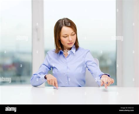 Smiling Woman Pointing To Something Imaginary Stock Photo Alamy