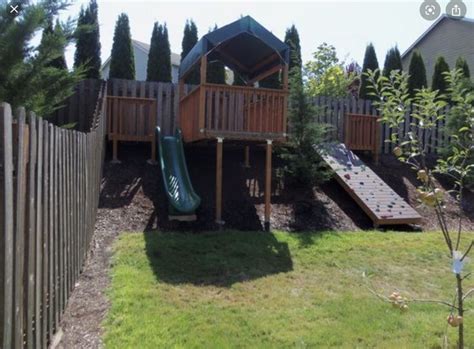 Pin By Jen Organ On Garden Sloped Backyard Backyard Playground