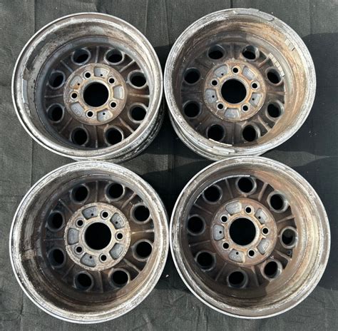 4 15 VINTAGE 1973 1987 CHEVY C10 HIGH POLISHED OEM WHEELS 15X7 RIMS