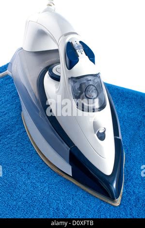 Ironing A Towel With A Steam Iron On An Ironing Board Stock Photo Alamy