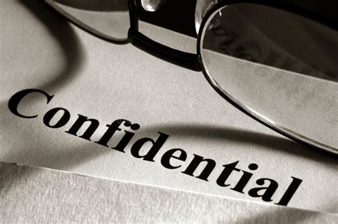Confidential Document in File Folder and Glasses. Confidential document