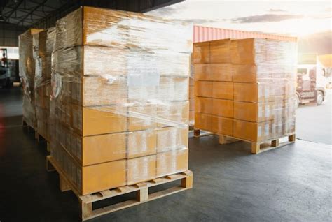 Premium Photo Packaging Boxes Stacked Wrapped Plastic On Pallets In