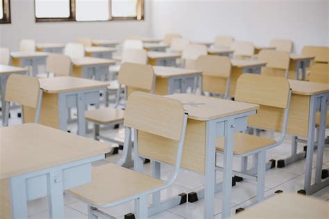 Premium Photo Row Of Wooden Tables And Chairs Well Arranged In Empty Classroom