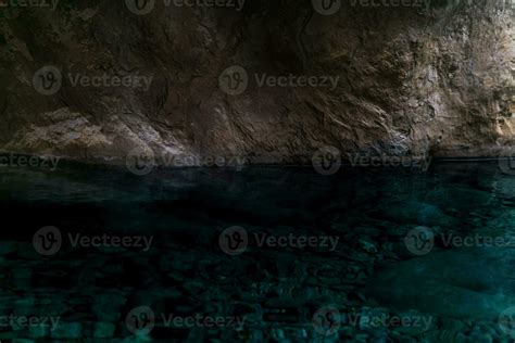 clean underground cave river in steep stone banks in the dark 37007408