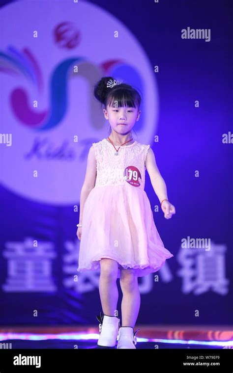 A child model displays a creation at a children model contest in Jimo