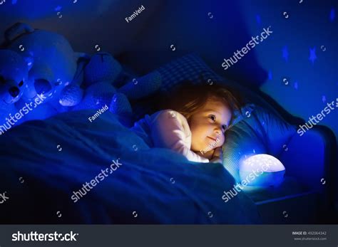 Little Girl Reading Book Bed Dark Stock Photo 492064342 | Shutterstock