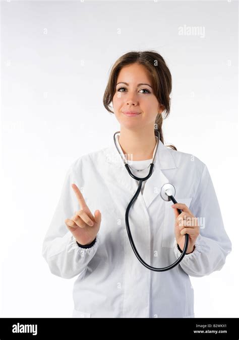 Cute Brunette In White Medical Gown And A Stethoscope Stock Photo Alamy