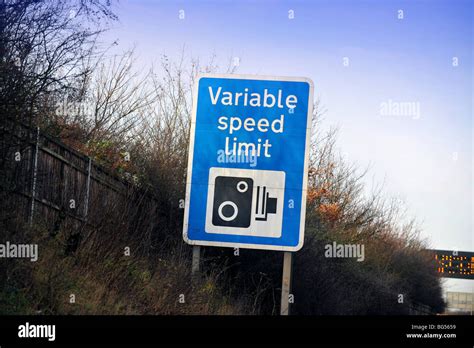 UK motorway warning sighn, variable speed limit Stock Photo - Alamy