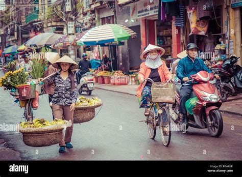 HAI PHONG, VIETNAM - NOVEMBER 12, 2018: People at busy morning street in Hai Phong, Vietnam ...