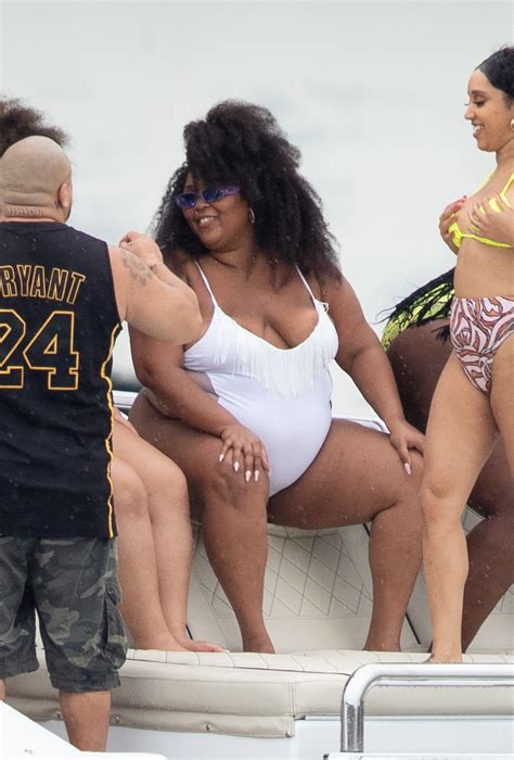 Lizzo Wears White Swimsuit Flosses Copious Curves Aboard Yacht In Miami