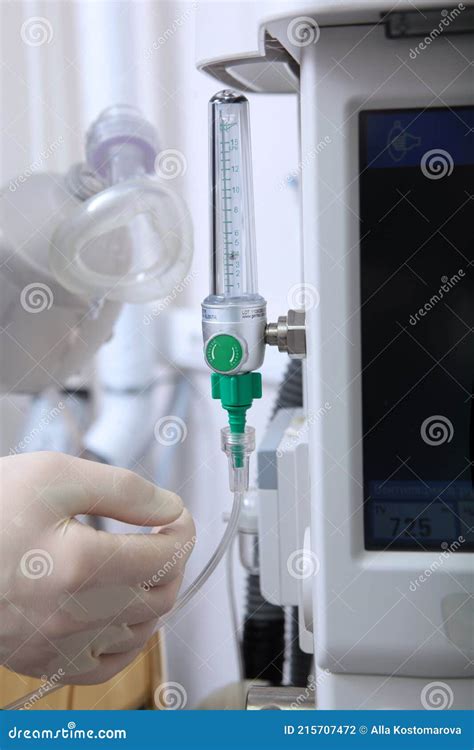 The Anesthesiologist Turns On The Machine For Artificial Ventilation Of