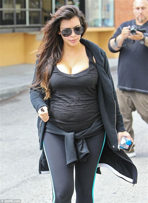 Kim Kardashian Keeps Her Pregnancy Curves Under Wraps As She Heads To