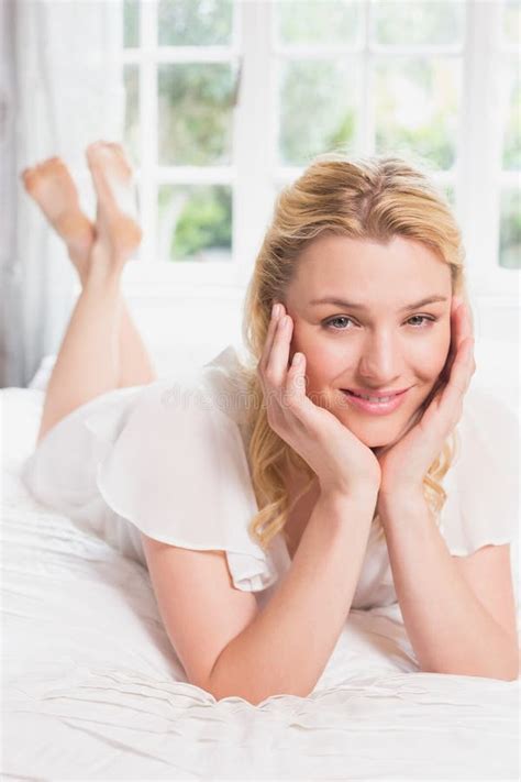 Pretty Blonde Lying On Bed Smiling At Camera Stock Photo Image Of View Spare 42552766