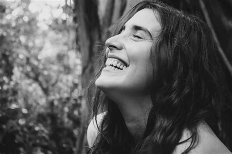 Black and White Photo of the Face of a Smiling Woman · Free Stock Photo