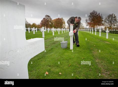 Gardener Mick Howard Cleaning One Of The 3 811 Headstones At The