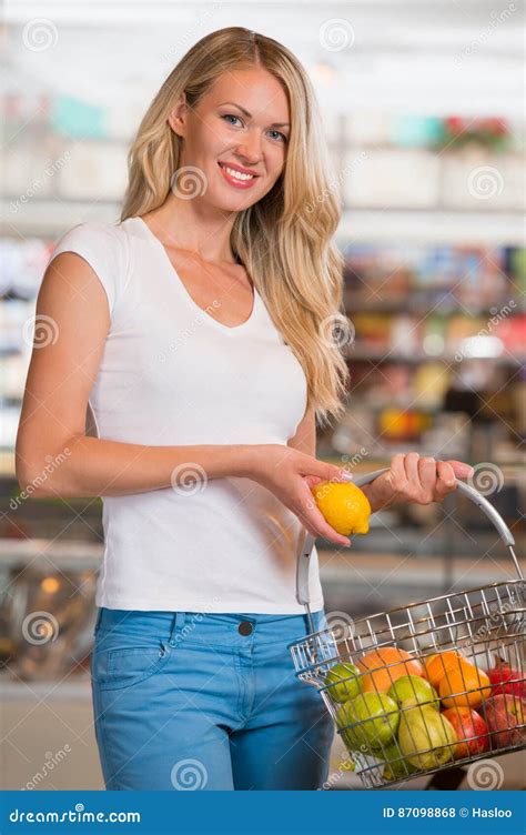 Casual Woman Grocery Shopping At Organic Food Section Stock Photo