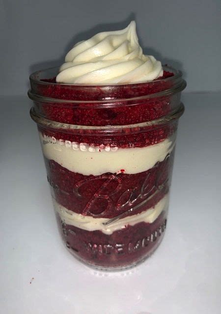 Red Velvet Dessert In A Glass Jar With Whipped Cream