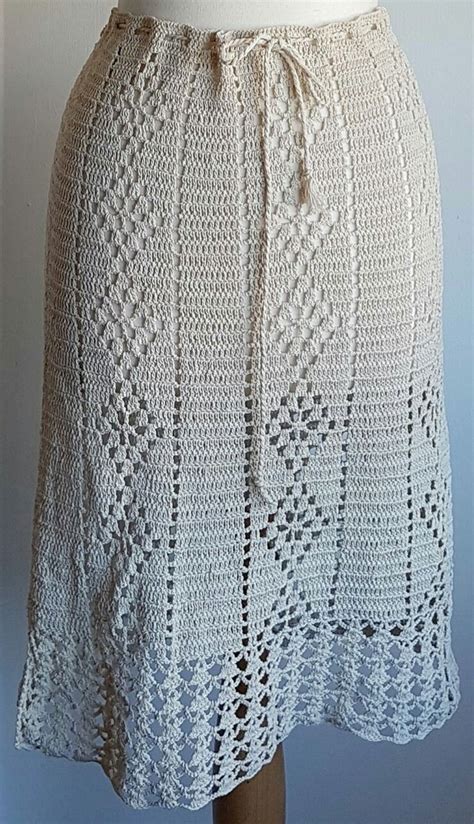 A White Crocheted Skirt On A Mannequin