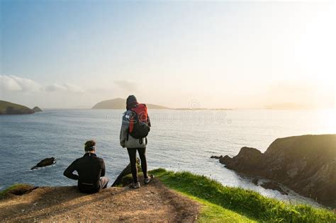 Couple of Tourists at Dunquin or Dun Chaoin Pier, Ireland S Sheep Highway. Narrow Pathway ...