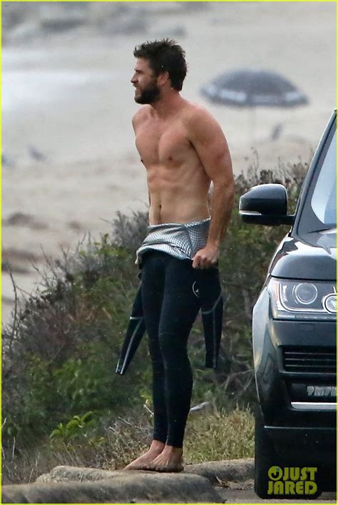 Liam Hemsworth Bares Ripped Abs While Stripping Out Of Wetsuit Photo 3796101 Liam Hemsworth