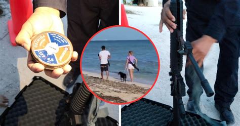 Mujer pasea con rifle en playas de Yucatán y alarma a turistas policía