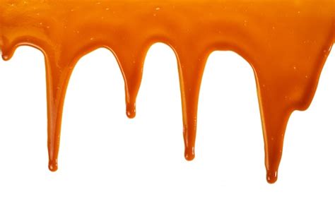 Caramel Syrup Drizzle Isolated On White Splashes Of Sweet Caramel