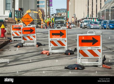 Barricades direct traffic around road construction site in downtown St ...