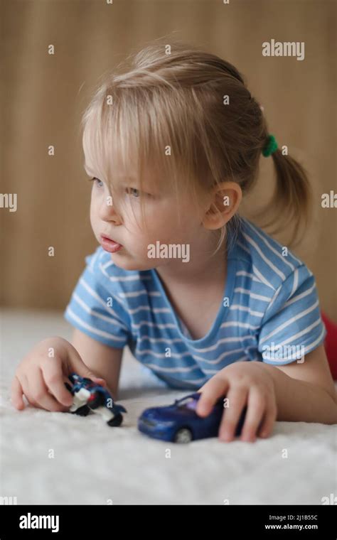 Child playing with small cars hi-res stock photography and images - Alamy