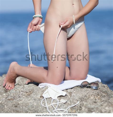Untying Bikini Over Royalty Free Licensable Stock Photos