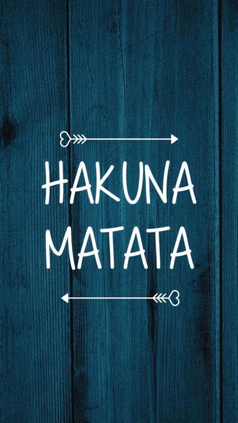 The Words Hakuna Matata Written In White On A Blue Wooden Background