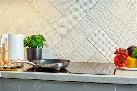 Induction hob with frying pan, Kitchen appliance 24596984 Stock Photo at Vecteezy