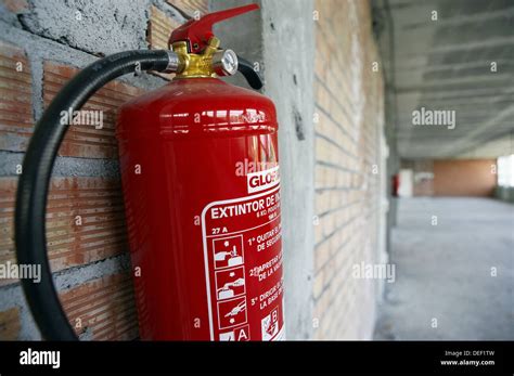 Fire extinguisher, office building under construction Stock Photo - Alamy