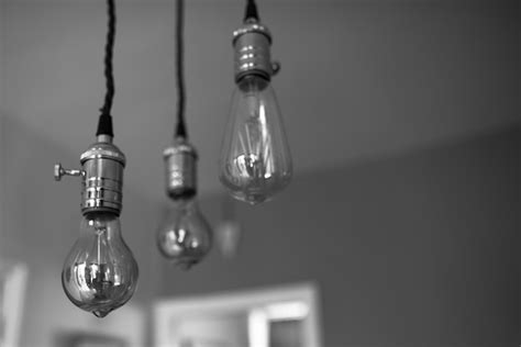 Premium Photo Low Angle View Of Light Bulbs Hanging From Ceiling