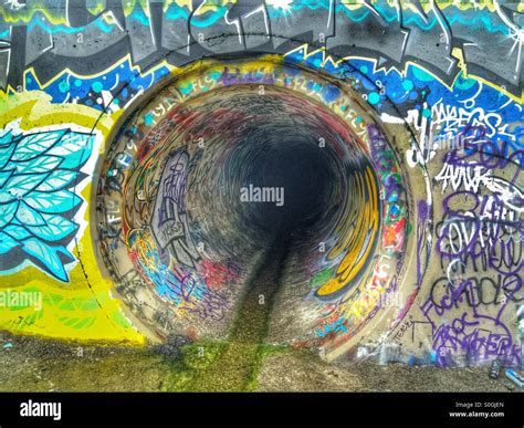 Rain Storm drainage pipe graffiti Stock Photo - Alamy