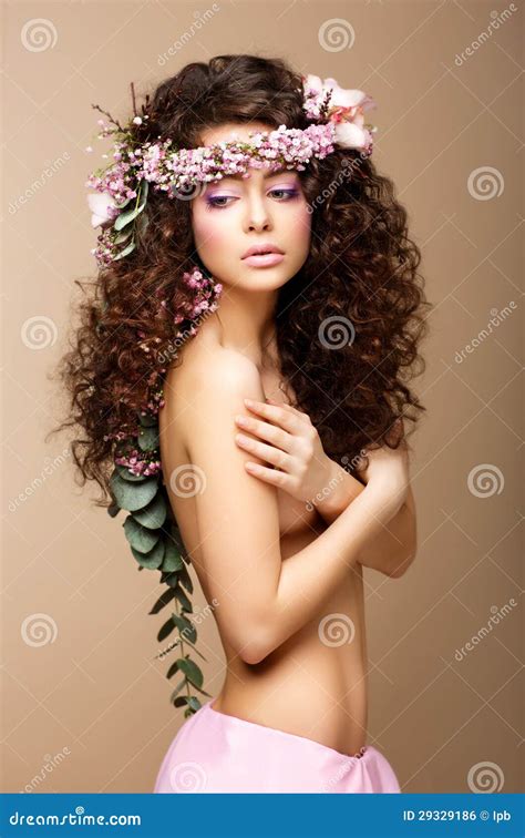 Sultry Beauty Attractive Naked Woman With Long Curly Hair And Wreath