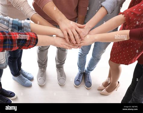 Young People Putting Hands Together As Symbol Of Unity Stock Photo Alamy