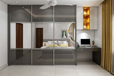 Spacious Sliding Door Wardrobe Design With Glossy Finish | Livspace