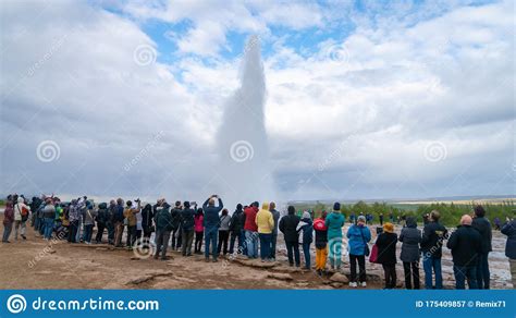 The Strokkur Geyser In Iceland Is Erupting While Tourists Are Looking