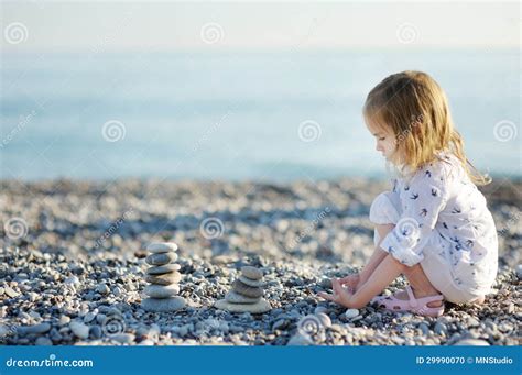 Cute Girl Playing On Pebble Beach Stock Photo Image Of Scene Playing