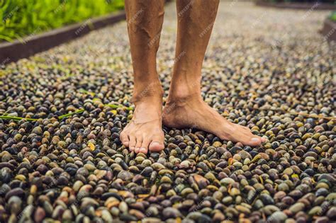 Premium Photo Man Walking On A Textured Cobble Pavement Reflexology