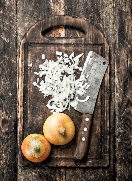 Premium Photo Fresh Onion With Old Hatchet On A Cutting Board On A