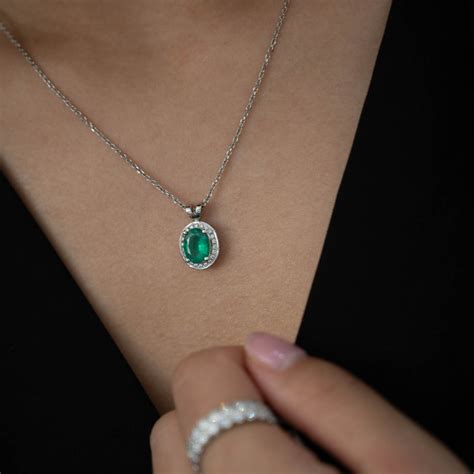 Beards Platinum Emerald And Diamond Halo Pendant