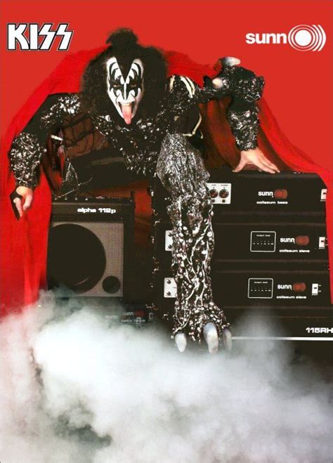 A Man Dressed As Kiss On Top Of A Boombox