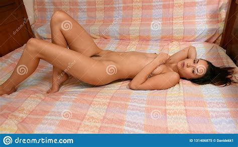 Close Up Nude Beautiful Brunette With Long Legs Posing On Bed Stock Image Image Of Girl
