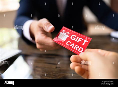 Holding Giving T Card Voucher Stock Photo Alamy