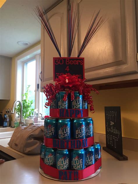 A Birthday Cake Made Out Of Beer Cans