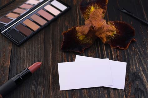 Premium Photo Business Cards Pink Matte Nude Lipstick And Iris Flower On A Wooden Table A