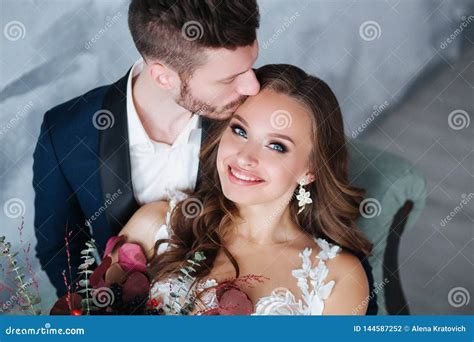 Portrait Of Beautiful Wedding Couple Together Bride And Groom Kiss And