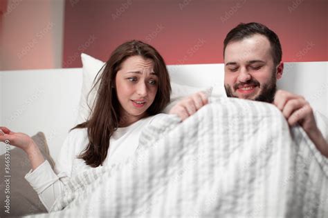 Couple In Bed Happy Bearded Caucasian Smiling Man Looking Under White